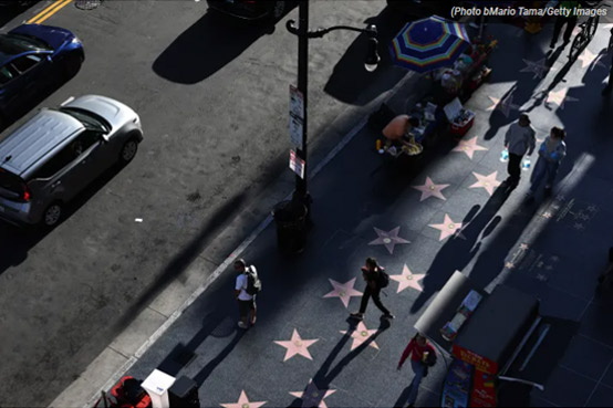 File - People walk along the Hollywood Walk of Fame on Hollywood Boulevard on April 17, 2024 in Hollywood, California. File - People walk along the Hollywood Walk of Fame on Hollywood Boulevard on April 17, 2024 in Hollywood, California.
